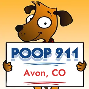 POOP 911 Avon, Colorado yard sign being held by a Smiling Brown Dog.